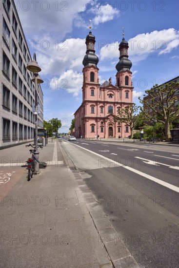 St. Peter church, double tower, onion tower, Rococo style, general architecture, modern buildings, lantern, bicycle, road, lanes, directional arrows, trees, blue sky, cumulus clouds, street Große Bleiche, Mainz, state capital, district-free city, Rhineland-Palatinate, Germany