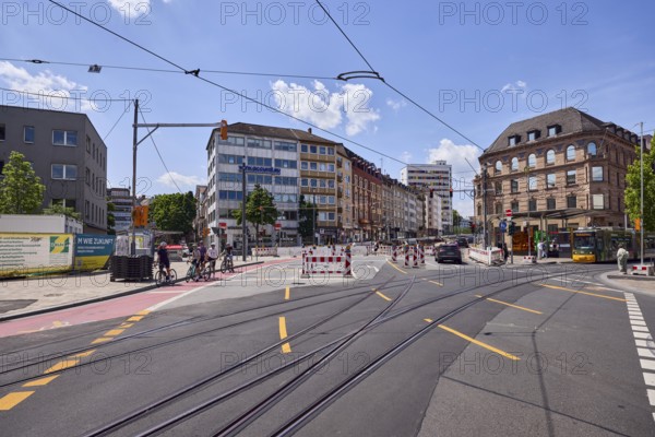 Traffic area, road construction, barriers, road, square, general architecture, tram tracks, overhead lines, road markings lanes, yellow marked lanes, cyclists and pedestrians as secondary motifs, blue sky, cumulus clouds, intersection Schillerstraße with Große Bleiche and Münsterplatz, Mainz, state capital, district-free city, Rhineland-Palatinate, Germany