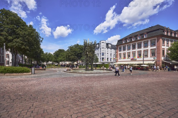 Cafe Extrablatt, carnival fountain, fountain with bronze sculptures, general architecture, building, paving stone square, outdoor area, café, pedestrians as a secondary motif, trees, blue sky, cumulus clouds, Schillerplatz square, Mainz, state capital, district-free city, Rhineland-Palatinate, Germany