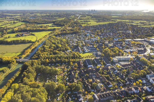 Aerial view, Werries residential area on the Datteln-Hamm Canal, Ostwennemarstraße canal bridge, autumn trees, Uentrop, Hamm, Ruhr area, North Rhine-Westphalia, Germany, bridge, trees in autumn colors, DE, Europe, property tax, autumn colors, autumn colors, autumn mood, real estate, canal, aerial photography, aerial photography, overview, bird's eye view, residential complex, living and living, residential area, quality of living, housing estate, residential district, birds-eyes view, autumnal tree-lined avenue, overview