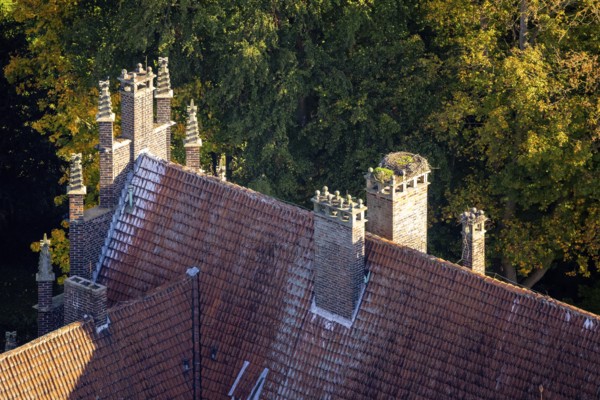 Aerial view, Heessen Castle private school and boarding school, stork nest on the roof fireplace, autumn trees, Heessen district, Hamm, Ruhr area, North Rhine-Westphalia, Germany, castle, trees in autumn colors, DE, roof, Europe, autumn, autumn colors, autumn mood, aerial photography, aerial photography, nest, castle, stork tower, overview, birds-eyes view, overview