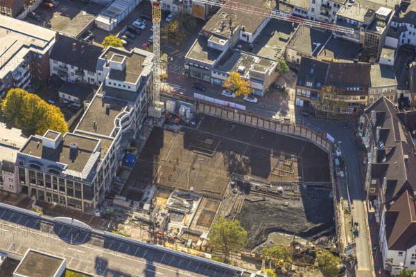 Aerial view, construction site with demolition and new construction of the western half of the Ritterpassage at the Allee-Center shopping center, Mitte, Hamm, Ruhr area, North Rhine-Westphalia, Germany, demolition, avenue center, construction site, building plots, construction crane, construction project, construction site, DE, roof with parking deck, shopping mile, shopping center, development, Europe, progress, buildings, shops, commercial sector, background, portrait format, infrastructure, crane, aerial view, aerial photography, aerial photography, northern Germany, perspective, Ritterpassage, city, cityscape, urban planning, structure, overview, urban, traffic, change, bird's eye view, western half, economy, birds-eyes view, modern, overview, overview