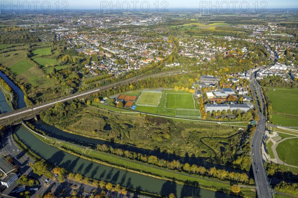 Aerial view, town view of the district of Heeßen, tennis courts, hockey and tennis club Hamm with padel tennis, soccer stadium sports ground BV 09 Hamm, ICE train on the Hafenstraße railway bridge over the river Lippe and Datteln-Hamm Canal, road traffic Münsterstraße and Auenpark with viewing platform Erlebensraum Lippeaue, Mitte, Hamm, Ruhr area, North Rhine-Westphalia, Germany, bridge, DE, Deutsche Bahn AG, Europe, aerial view, aerial photography, passenger transportation, passenger transport, passenger train, overview, bird's eye view, train, train traffic, birds-eyes View, overview