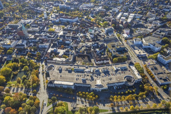 Aerial view, city and construction site with demolition and new construction of the western half of the Ritterpassage at the Allee-Center shopping center, autumn trees, Mitte, Hamm, Ruhr area, North Rhine-Westphalia, Germany, demolition work, avenue center, architecture, construction site, construction site, DE, roof with parking deck, shopping mile, shopping center, development, Europe, progress, buildings, businesses, commercial, commercial area, background, portrait format, infrastructure, crane, aerial view, aerial photography, aerial photography, northern Germany, perspective, knight's passage, city, cityscape, urban planning, structure, overview, urban, traffic, change, bird's eye view, western half, economy, birds-eyes view, modern, overview, overview