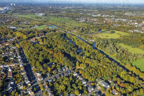 Aerial view, spa park with autumn trees, view of Hamm-Lippewiesen airfield, Lippe river meander and Datteln-Hamm canal, Üntrop, Hamm, Ruhr area, North Rhine-Westphalia, Germany, trees in autumn colors, DE, Europe, autumn, autumn colors, autumn forest colors, aerial photography, aerial photography, park, overview, bird's eye view, forest in autumn colors, birch ds-eyes view, autumn trees, autumn forest, overview