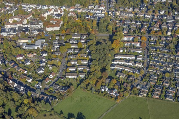 Aerial view, row house residential area Huckenholz, Johanniter-Kliniken Hamm location Knappenstraße, Üntrop, Hamm, Ruhr region, North Rhine-Westphalia, Germany, trees in autumn colors, DE, Europe, healthcare, property tax, autumn colors, autumn mood, hospital, clinic, hospital, aerial photo, aerial photography, aerial photography, medical facility, medical assistance, apartment buildings, rental houses, townhouses, overview, bird's eye view, residential complex, housing and living, residential area, residential buildings, quality of living, residential district, residential area, birds-eyes view, autumn trees, overview, medical care