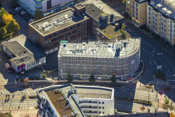 Aerial photo, construction site new apartment building for student living at the intersection Neue Bahnhofstraße and Friedrichstraße next to the health department, Mitte, Hamm, Ruhr region, North Rhine-Westphalia, Germany, apartment building, architecture, view, construction project, construction site activity, construction site vehicles, DE, drone photography, development, Europe, Friedrichstraße, building, health department, infrastructure, construction, cranes, aerial photography, photography, aerial photography, new building, Neue Bahnhofstraße, perspective, summer, city, urban development, urban landscape, road intersection, daylight, overview, urban, traffic routes, bird's eye view, residential building, birds-eyes view, modern architecture, overview, student housing