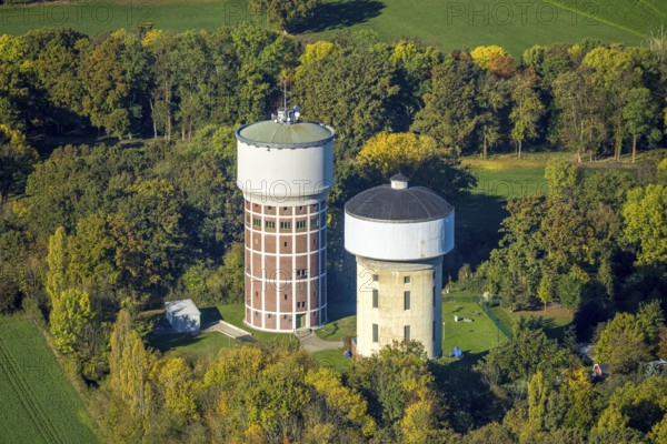 Aerial view, two water towers, tower WT2000 and tower WT3000, water supply for the city of Hamm, autumn trees, mixed oak forest red hedge, Rhynern district, Hamm, Ruhr area, North Rhine-Westphalia, Germany, trees in autumn colors, DE, Europe, autumn, autumn colors, autumn forest colors, aerial photo, aerial photography, overview, bird's eye view, forest in autumn colors, forest area, water tower, water supply, birds-eyes view, autumnal forest, overview
