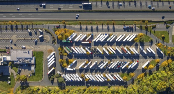 Aerial view, Serways Rhynern rest area with truck parking lot on the A2 motorway, shapes and colors, Rhynern district, Hamm, Ruhr area, North Rhine-Westphalia, Germany, DE, Europe, truck parking space, truck traffic, aerial photography, parking spaces, rest area, road traffic, overview, birds-eyes view, overview