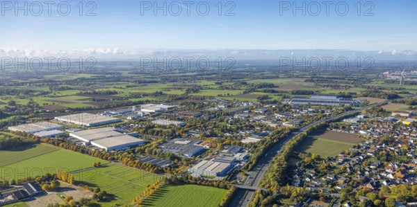 Aerial view, Oberster Kamp industrial park on the A2 motorway, meadows and fields with distant views, Wambelner Straße bridge across the motorway, in the back the EDEKA central warehouse Hamm, Rhynern district, Hamm, Ruhr area, North Rhine-Westphalia, Germany, DE, Europe, commercial space, commercial property, industrial park, commercial location, industrial site, aerial photography, aerial photography, overview, bird's eye view, overview