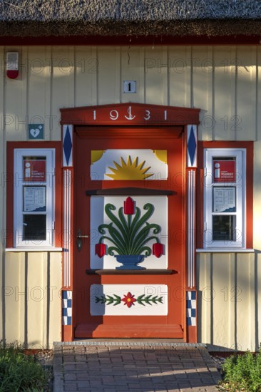 Decorative front door from 1931 on a residential building, Ahrtenshoop, Darß, Mecklenburg-Western Pomerania, Germany