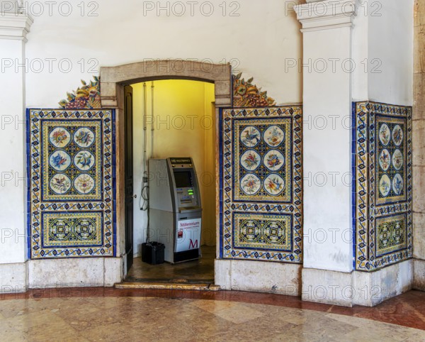 Cash machine at the entrance to r Mercadeo da Ribeira, also known as TimeOut Market, the best address for Portuguese specialties and international cuisine. Historic market hall at Cais do Sodré railway station, Lisbon, Portugal