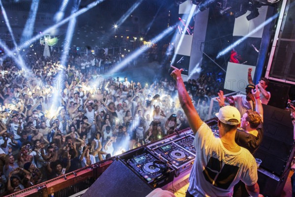 EDITORIAL and NEWS ONLY, rare moment of joint DJ back to back performance of edm dance music DJ Afrojack (on top, the person standing up on DJ pult) performing with DJ Hardwell on DJ pult at Starbeach events festival Hersonissos, Crete, Greece, on 17. July 2017