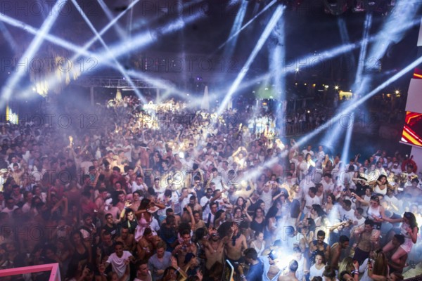 EDITORIAL and NEWS ONLY, crowd cheering towards rare moment of joint DJ back to back performance of edm dance music DJ Afrojack performing with DJ Hardwell on DJ pult at Starbeach events festival Hersonissos, Crete, Greece, on 17. July 2017