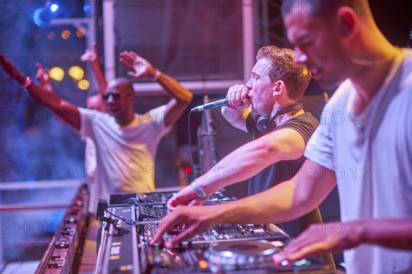 EDITORIAL and NEWS ONLY, rare moment of joint DJ back to back performance of edm dance music DJ Hardwell (in the middle) performing next to DJ Afrojack (at the right) on DJ pult at Starbeach events festival Hersonissos, Crete, Greece, on 17. July 2017