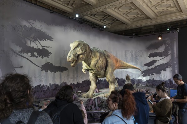 London, United Kingdom - 15 May 2025: The thrill of prehistory: looking at a giant dinosaur model at the Natural History Museum