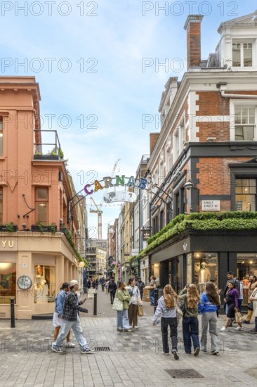 London, United Kingdom - 15 May 2025: Famous Carnaby street colorful sign welcoming visitors to the vibrant Soho district