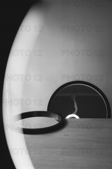 Two round mirrors, interior view of a mirror