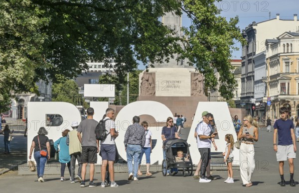 Riga lettering, Tourists, Freedom Square, Brivibas Laukums, Old Town, Riga, Latvia