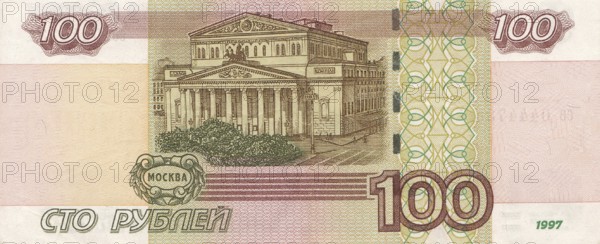 Paper banknote of 100 rubles, printed by the Central Bank of Russia for domestic financial issuance and to support the country's economy. It depicts the Bolshoi Theatre building with Apollo's quadriga in Moscow. Moscow, Russian Federation