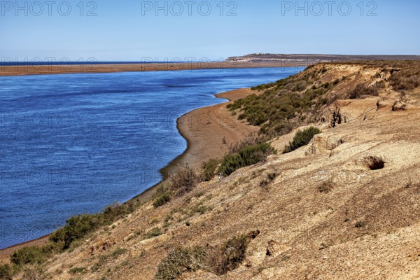 Estuary into the sea with rocky coast and extensive landscape, The landscape of Peninsula Valdes in Argentina