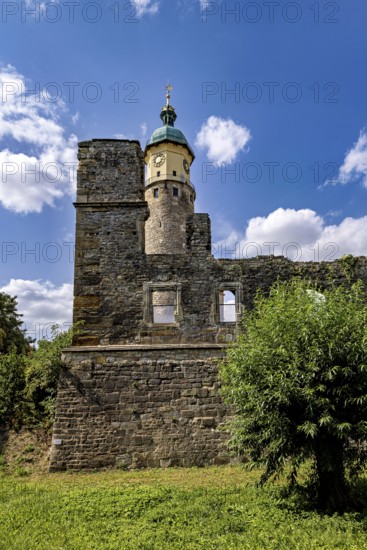 Tower and ruins against a clear blue sky with scattered clouds, The Niedeck Ruins in Arnstadt Thuringia