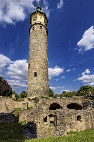 High stone tower against a cloudy blue sky, The Niedeck Ruins in Arnstadt Thuringia