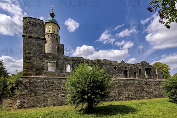 Ruins with a tower along a wall, blue sky with clouds in the background, The Niedeck Ruins in Arnstadt Thuringia