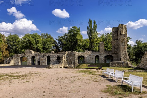 Ruins with stone walls, benches and trees under a clear sky, The Niedeck Ruins in Arnstadt Thuringia