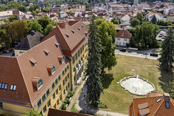 Aerial view of historic buildings with fountain and green area, The old town of Arnstadt in Thuringia