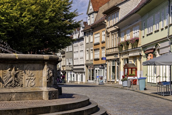 Historic street with facades and a fountain on the cobblestones, The old town of Arnstadt in Thuringia