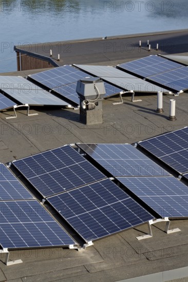 Solar panels on roof of apartment building, renewable green sustainable energy concept, water cooling, aerial view, Gothenburg, Sweden