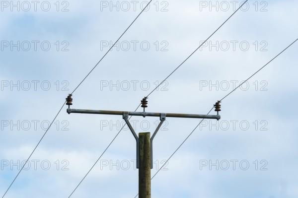 Borken, nrw, germany, utility pole holding electrical power lines against cloudy sky