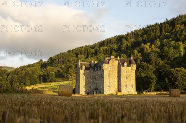 Castle Menzies and hay bales, Weem, Aberfeldy, Perthshire, Scotland, UK
