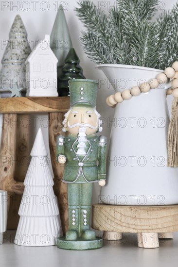 Beautiful farmhouse or boho style Christmas home decoration with trendy mint green nutcracker