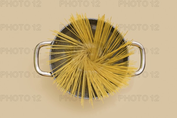 Top view of a pan of spaghetti pasta in boiling water