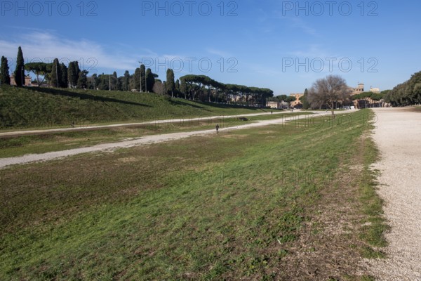 View along today green embankment former spina central element of in Circus Maximus venue of chariot races towards ancient southeast bend and former start area, Rome, Lazio, Italy