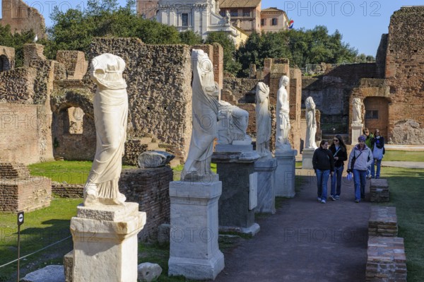Ancient marble statues in the area of the House Garden of the Vestals, Roman Forum, Rome, Lazio, Italy
