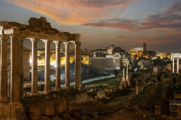 Night view photo at dusk evening view of Roman Forum, left column ruin remains of Temple of Saturn, Rome, Lazio, Italy