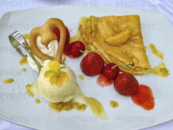 Calorie dessert dessert cream with a scoop of vanilla ice cream fruits strawberries cherries, international