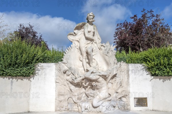 The light stone fountain sculpture La Naissance de Venus (The Birth of Venus) by sculptor Henri Greber depicts the mythological figure of Venus standing on a sea animal or a shell and is surrounded by green spaces in Beauvais, Oise department (60), Hauts-de-France region, France