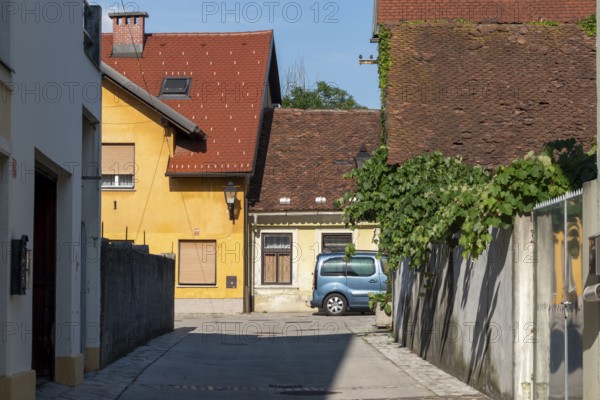 Old crouched houses, car, color contrast, Kranj, Upper Carniola, Slovenia
