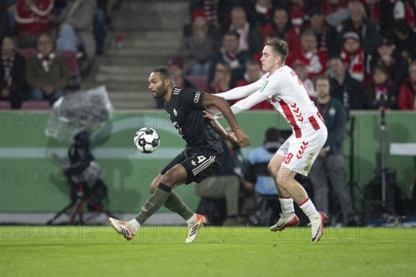 (DFL/DFB REGULATIONS PROHIBIT ANY USE OF PHOTOGRAPHS AS IMAGE SEQUENCES AND/OR QUASI-VIDEO), Rhein Energie Stadion, Cologne, North Rhine-Westphalia, Jonathan Tah (FC Bayern Munich, Defence, #4), Isak Joannesson (1.FC Cologne, Midfield, #18), DFB-Pokal 1.FC Cologne, FC Bayern Munich on 29.10.2025 at the Rhein Energie Stadium in Cologne Germany