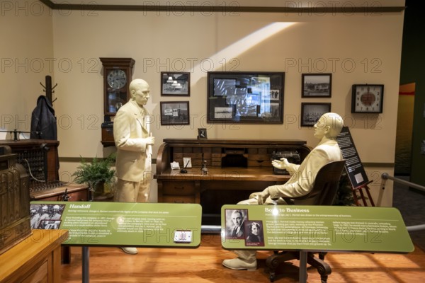 Austin, Minnesota - The SPAM Museum. SPAM is a lunch meat made of pork and ham, canned by Hormel Foods. A display shows Hormel founder George A. Hormel handing control of the company to his son, Jay C. Hormel