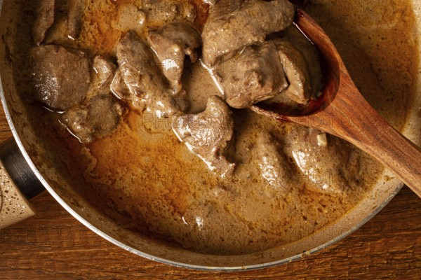 Beef stroganoff, pan cooking, close-up, homemade