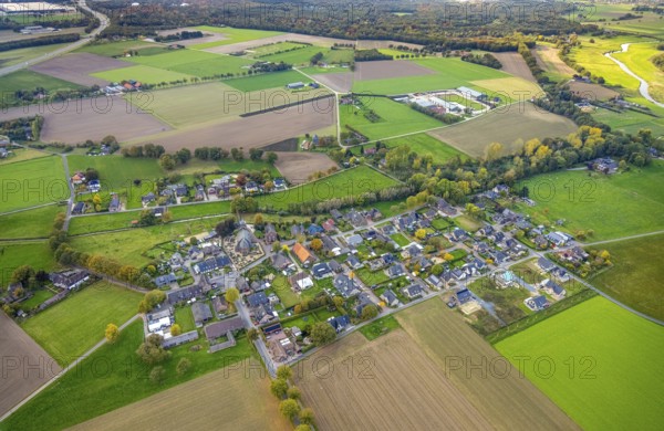 Aerial view, residential area town view district of Hommersum with parish church of St. Peter and cemetery, meadows and fields, Hommersum, Goch, Lower Rhine, North Rhine-Westphalia, Germany, place of worship, burial place, DE, Europe, cemetery, memorial, religious community, church, church, cemetery, cemetery, church, denomination, aerial photo, aerial photography, religion, place of worship, resting place, overview, bird's eye view, residential complex, living area, quality of living, residential district, residential area, birds-eyes view, overview