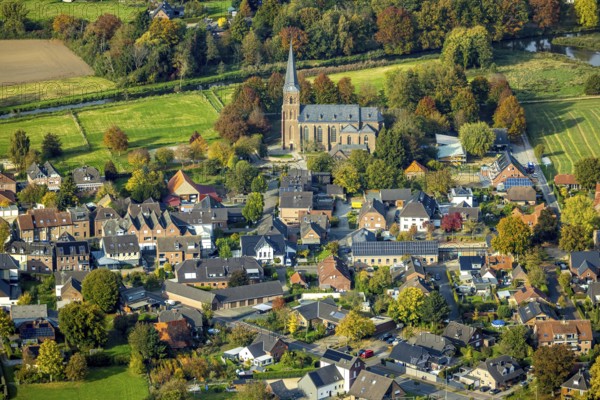 Aerial view, residential area district of Kessel with St. Stephen's Church and Niers-Kendel elementary school, Kessel, Goch, Lower Rhine, North Rhine-Westphalia, Germany, place of worship, education, educational institution, DE, Europe, religious community, church, property tax, holy place, real estate, church, parish, denomination, teaching institute, aerial photography, aerial photography, religion, religious place, school, overview, bird's eye view, residential complex, housing and living, residential area, residential quality, residential district, housing development, residential district, birds-eyes View, overview