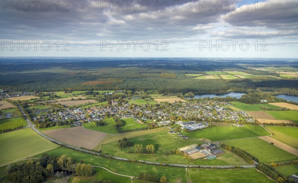 Aerial view, residential area district of Kessel with St. Stephen's Church and Reichswald, blue sky with clouds, Kessel, Goch, Lower Rhine, North Rhine-Westphalia, Germany, place of worship, education, educational institution, DE, Europe, forest, religious community, church, church, teaching institute, holy place, autumn colors, autumn forest, autumn forest, autumn forest, autumn forest colors, real estate, church, church community, denomination, teaching institute, aerial view, aerial view, aerial view, Aerial Photography, Mixed Forest, Religion, Religious Place of Worship, School, Overview, Bird's Eye View, Forest, Wooded Area, forest location, residential complex, residential area, quality of living, residential district, residential area, residential district, birds-eyes view, autumnal forest, overview
