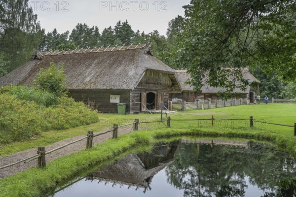 Pond near the village, wooden house, farmhouse, Latvian Ethnographic Open-air Museum, Brivdabas iela, Riga, Latvia