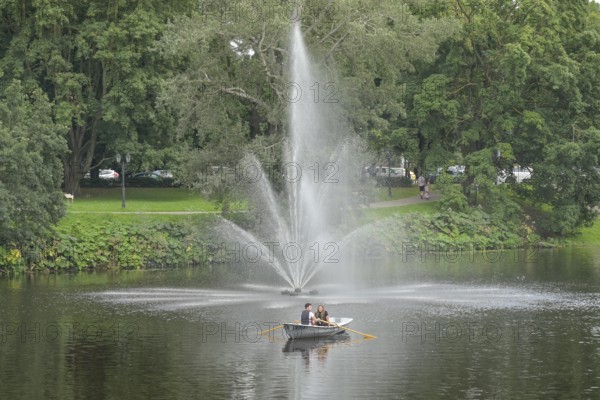 People, leisure, rowing boat, fountain, city canal, municipal park, Riga, Latvia